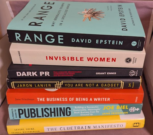 A stack of books: The Cluetrain Manifesto (10th Anniversary Edition); A People's Guide to Publishing (Updated and Expanded); The Business of Being a Writer (Second Edition); You Are Not a Gadget; Dark PR; Invisible Women; and Range.