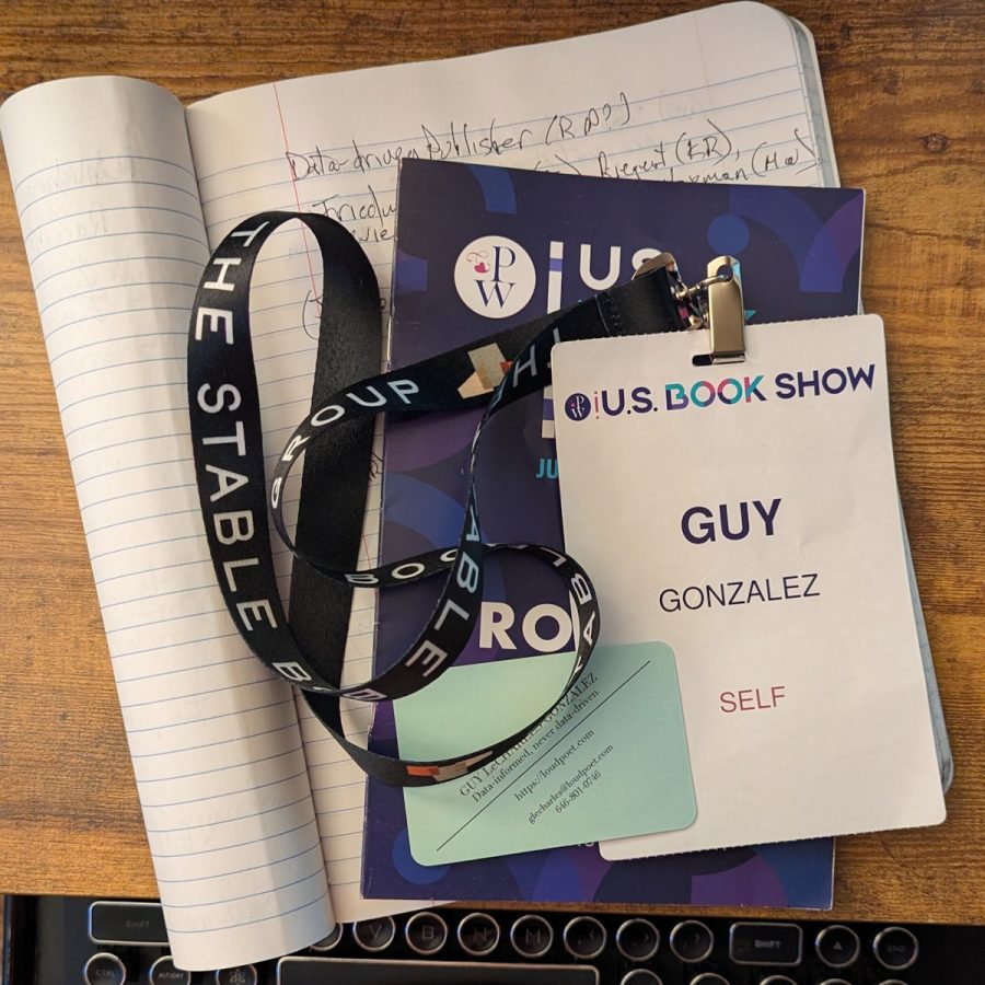 My US Book Show badge and program, sitting on top my notebook.